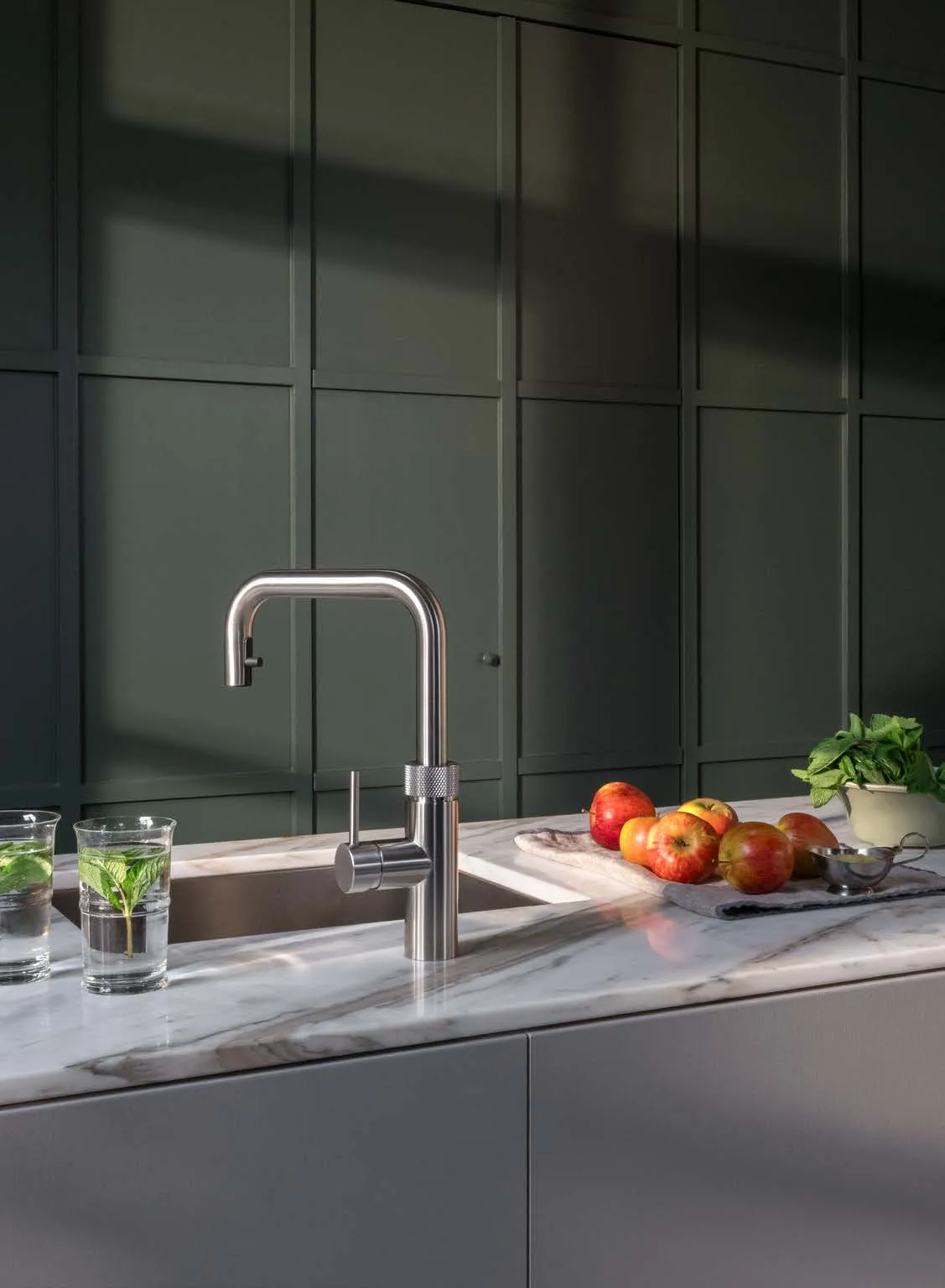 Quooker Fusion Square in gunmetal in a dark green kitchen