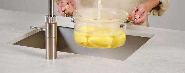 Quooker tap used for boiling potatoes